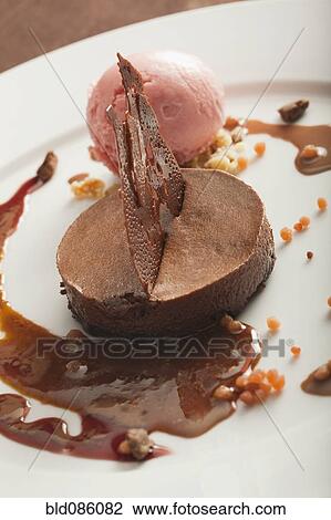 Stock Image - Close up of chocolate dessert on plate. Fotosearch