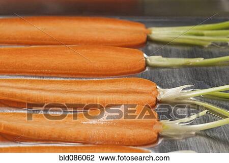 Stock Image - Close up of sliced carrots. Fotosearch