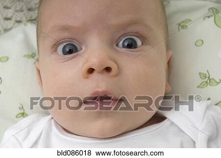 Close up of surprised baby View Large Photo Image Stock Photo - Close up of surprised baby. Fotosearch