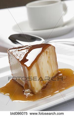 Stock Photography - Close up of syrup over slice of dessert. Fotosearch