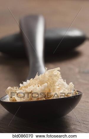 Stock Image - Close up of wooden spoon. Fotosearch
