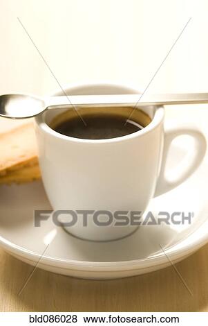 Stock Photo - Cup of espresso with spoon. Fotosearch