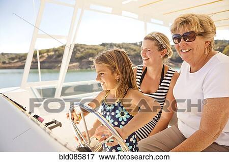 Family enjoying boat on lake View Large Photo Image Stock Photo - Family enjoying boat on lake. Fotosearch