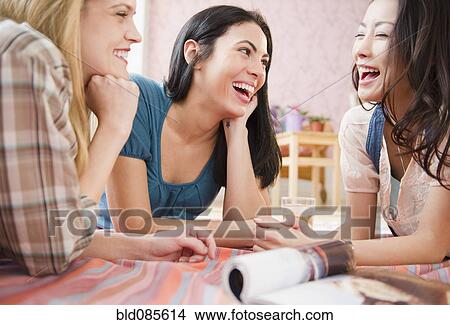 Friends socializing together View Large Photo Image Picture - Friends socializing together. Fotosearch