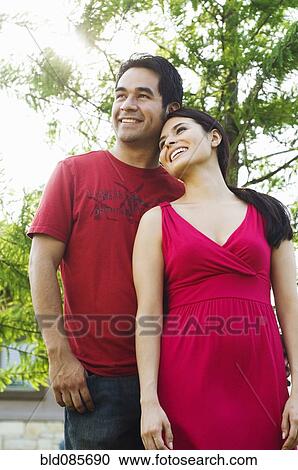 Hispanic couple standing together outdoors View Large Photo Image Stock Image - Hispanic couple standing together outdoors. Fotosearch