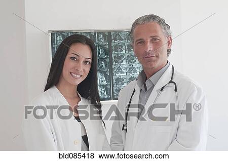 Stock Photo - Hispanic doctors standing together in hospital. Fotosearch