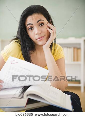 Hispanic woman studying in classroom View Large Photo Image Stock Photography - Hispanic woman studying in classroom. Fotosearch