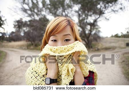 Korean woman covering her face with scarf View Large Photo Image Stock Image - Korean woman covering her face with scarf. Fotosearch