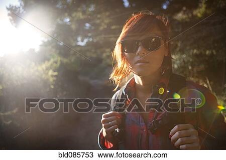 Korean woman in backpack and sunglasses View Large Photo Image Stock Image - Korean woman in backpack and sunglasses. Fotosearch