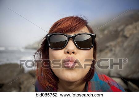 Korean woman puckering her lips View Large Photo Image Stock Image - Korean woman puckering her lips. Fotosearch