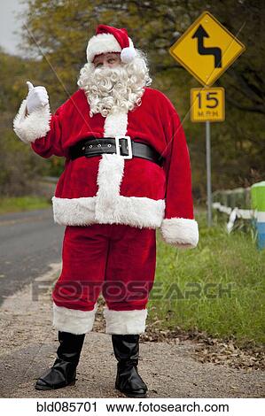 Santa hitchhiking at roadside View Large Photo Image Stock Image - Santa hitchhiking at roadside. Fotosearch