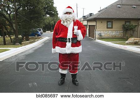 Santa standing in road View Large Photo Image Stock Photo - Santa standing in road. Fotosearch