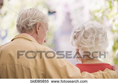 Stock Photography - Senior Chilean man hugging wife. Fotosearch