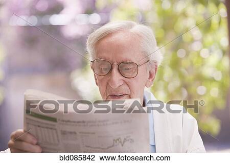 Senior Chilean man reading newspaper View Large Photo Image Stock Image - Senior Chilean man reading newspaper. Fotosearch