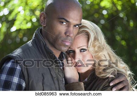 Serious couple hugging View Large Photo Image Stock Image - Serious couple hugging. Fotosearch