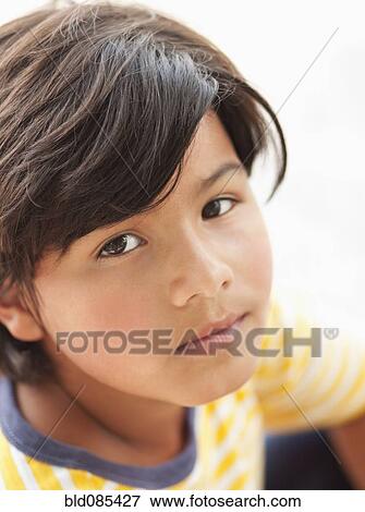 Serious Hispanic boy View Large Photo Image Stock Photo - Serious Hispanic boy. Fotosearch