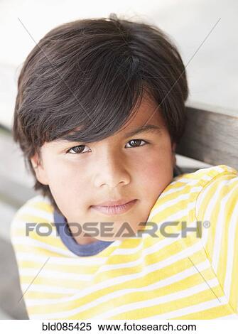 Stock Photography - Serious Hispanic boy. Fotosearch
