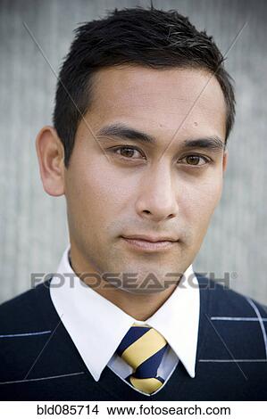 Picture - Serious mixed race businessman. Fotosearch