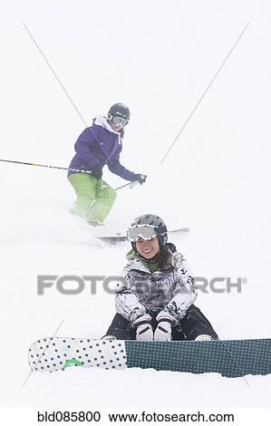 Skier and snowboarder on ski slope View Large Photo Image Stock Image - Skier and snowboarder on ski slope. Fotosearch