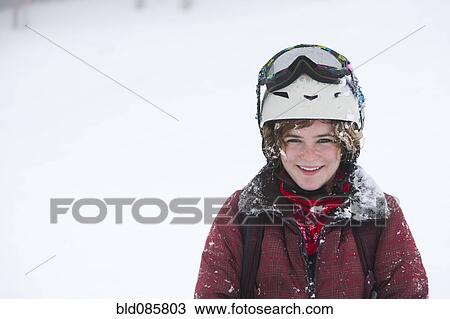 Stock Image - Skier standing in the snow. Fotosearch