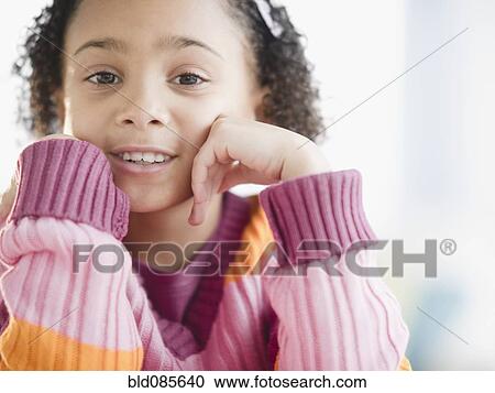Stock Image - Smiling African American girl. Fotosearch