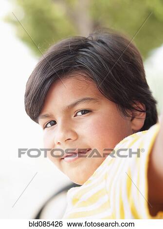 Stock Photograph - Smiling Hispanic boy. Fotosearch