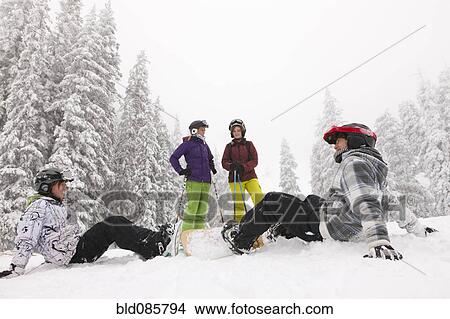 Snowboarders and skiers enjoying the snow View Large Photo Image Picture - Snowboarders and skiers enjoying the snow. Fotosearch