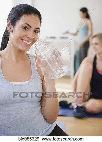 Women relaxing after exercise View Large Photo Image Stock Photo - Women relaxing after exercise. Fotosearch