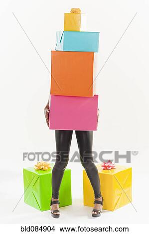 Picture - African American woman with birthday presents. Fotosearch