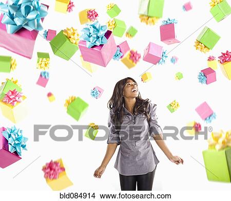 African American woman with falling birthday presents View Large Photo Image Picture - African American woman with falling birthday presents. Fotosearch