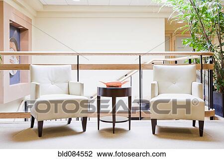 Stock Image - Armchairs in hotel lobby. Fotosearch