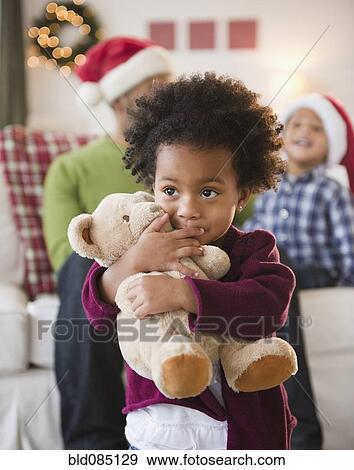Black girl hugging teddy bear View Large Photo Image Stock Photo - Black girl hugging teddy bear. Fotosearch