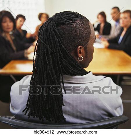 Stock Image - Business people having meeting in conference room. Fotosearch