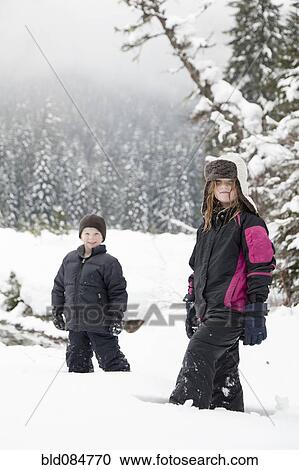 Caucasian children standing in snow View Large Photo Image Stock Image - Caucasian children standing in snow. Fotosearch