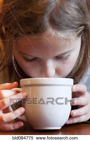 Caucasian girl drinking hot chocolate View Large Photo Image Stock Photography - Caucasian girl drinking hot chocolate. Fotosearch