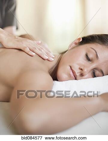 Stock Photo - Caucasian woman having a massage. Fotosearch