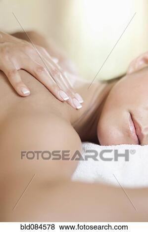 Caucasian woman having a massage View Large Photo Image Stock Photo - Caucasian woman having a massage. Fotosearch