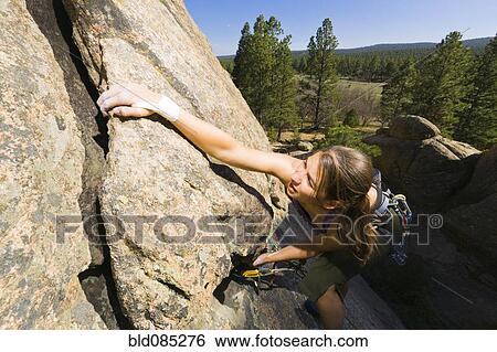 Caucasian woman rock climbing View Large Photo Image Stock Photograph - Caucasian woman rock climbing. Fotosearch