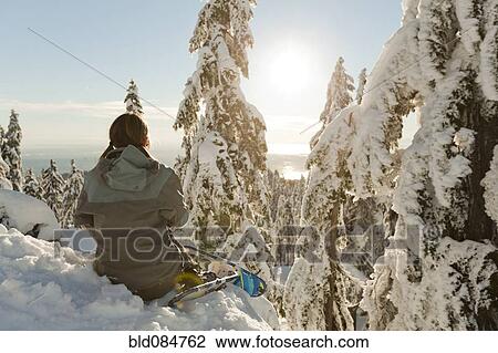 Caucasian woman snowshoeing in remote area taking break View Large Photo Image Stock Image - Caucasian woman snowshoeing in remote area taking break. Fotosearch