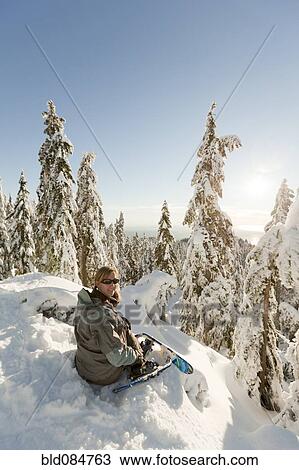 Caucasian woman snowshoeing in remote area taking break View Large Photo Image Stock Image - Caucasian woman snowshoeing in remote area taking break. Fotosearch