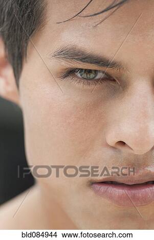 Picture - Close up of angry Hispanic man. Fotosearch