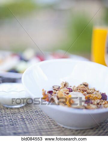 Stock Image - Close up of cereal in bowl. Fotosearch