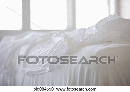 Close up of white sheets on bed View Large Photo Image Stock Image - Close up of white sheets on bed. Fotosearch