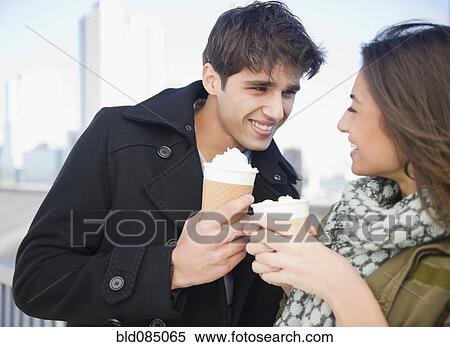 Stock Photography - Couple drinking coffee together. Fotosearch