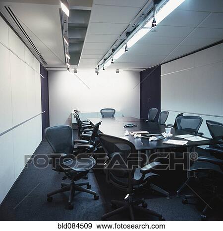 Stock Photo - Empty conference room with discarded papers. Fotosearch