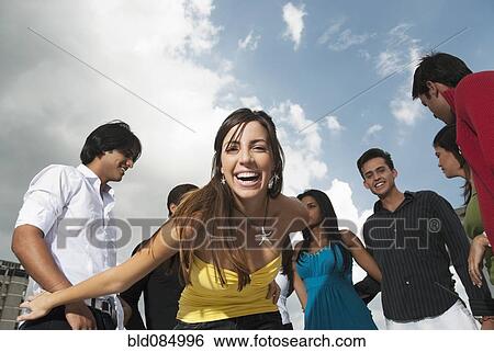 Friends hanging out together View Large Photo Image Stock Photograph - Friends hanging out together. Fotosearch