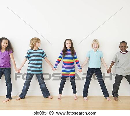 Stock Photo - Friends holding hands in a row. Fotosearch