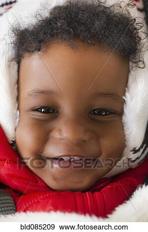 Grinning African American baby in cap View Large Photo Image Stock Photo - Grinning African American baby in cap. Fotosearch