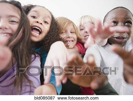 Stock Photo - Grinning, playful children. Fotosearch