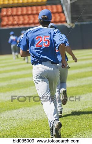 Stock Photo - Hispanic baseball player running on field. Fotosearch